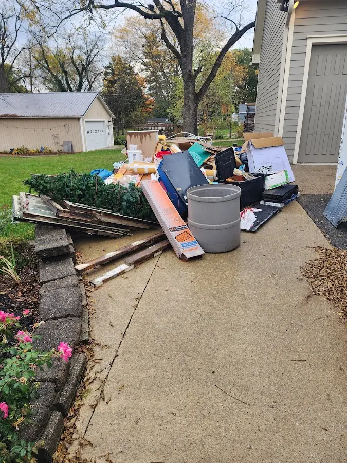 Dumpster being loaded with debris for Residential Dumpster Rental in Georgetown